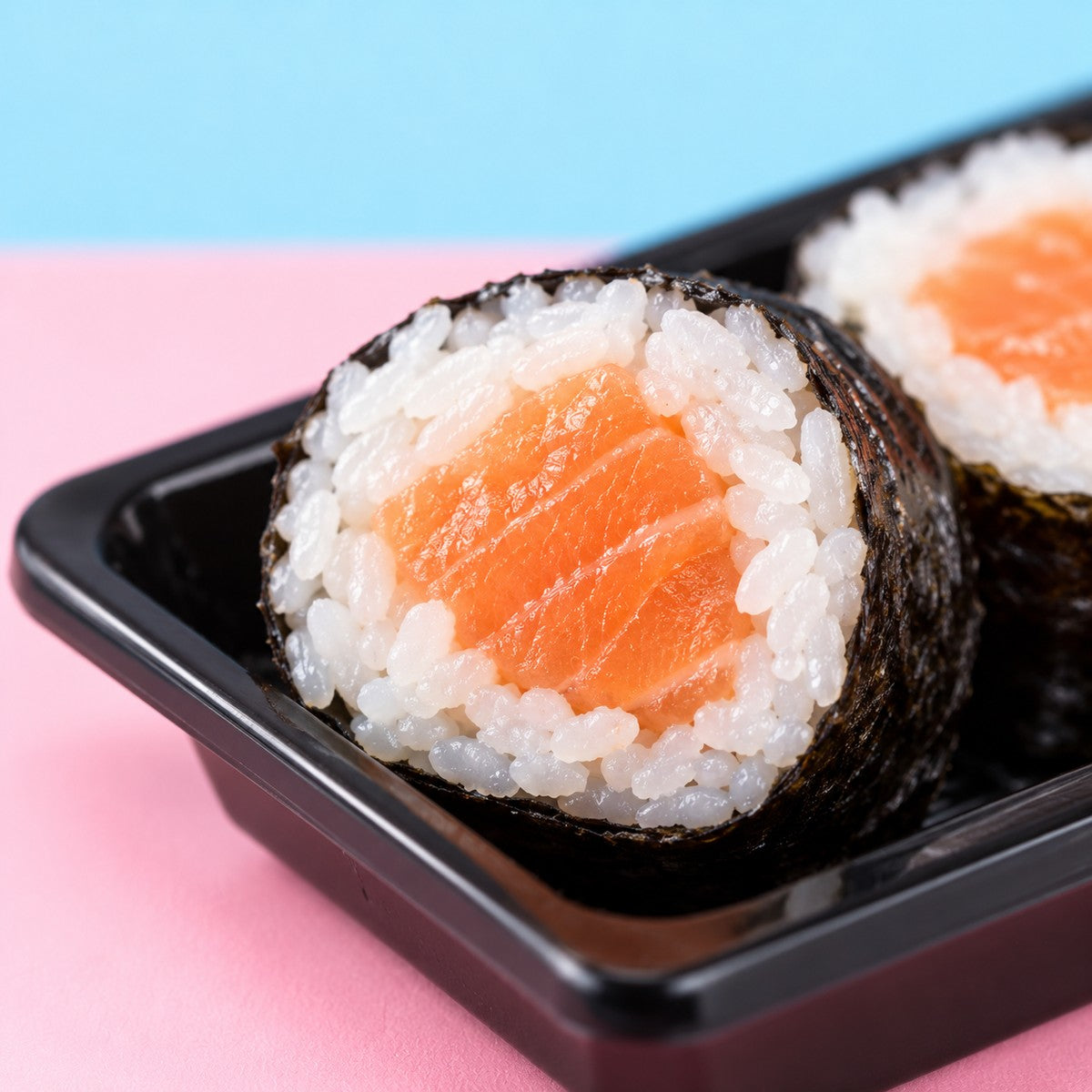 The Glowing Duo - Fusion Roll Box (12 Pcs) + Salmon Paradise (10 Pcs) — partial texture close-up; not the complete serving